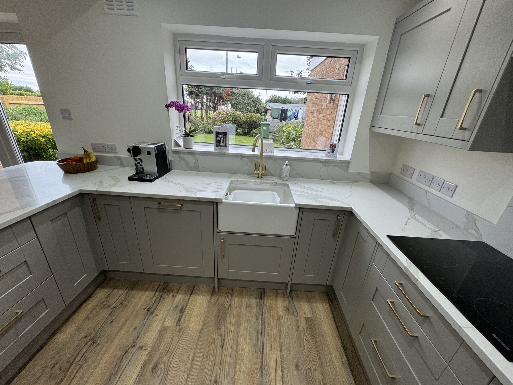 Cream English Shaker kitchen, sink and window detail, Wirral